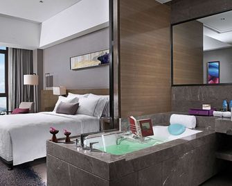 ويندهام جينجيانغ - تشيوانتشو - غرفة نوم