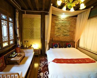 Lijiang Lvyeanjia Inn - Lijiang - Bedroom