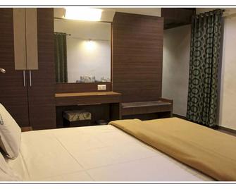Hotel Prem Nivas - מדוראי - חדר שינה