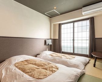 Tabist Sparkling Dolphins Inn Kyoto - קיוטו - חדר שינה