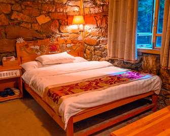 Sean Spring Guesthouse - Lijiang - Bedroom