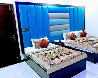 Galaxy Inn Guest House - 卡拉奇 - 臥室