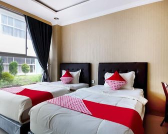 Collection O 3431 Hotel Alpha Bandara - פלמבאנג - חדר שינה