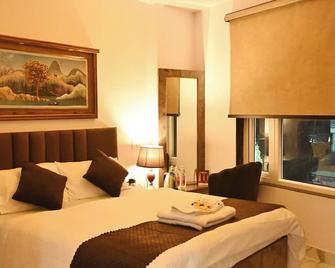 Brij Inn - Варанасі - Спальня