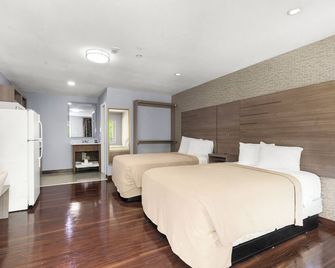 Travel Inn & Suites - האמבל - חדר שינה