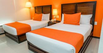 Comfort Inn Cancun Aeropuerto - Cancún - Schlafzimmer