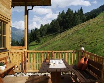 Apartment 'Kreuzkogel' in the organic log cabin - Rindereben, Bauerndörfl - Hüttschlag - Balcony