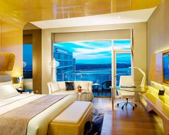 ويندام جراند تشينغداو - تشينغداو - غرفة نوم