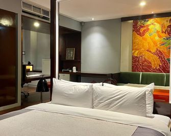 كيمانج أيكون هوتل - جاكرتا - غرفة نوم