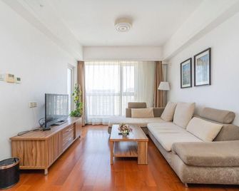 Qingdao Guyuanqing Apartment Hotel - 칭다오 - 침실