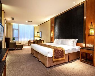 Ziqing Lake Hot Spring Holiday Hotel - Zhenjiang - Camera da letto