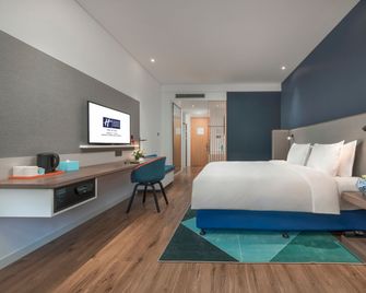 Holiday Inn Express Qingdao Chengyang Central By IHG - צ'ינגדאו - חדר שינה