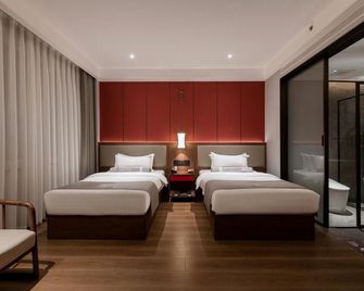 Zibo Zhiweizhai Hotel (City Government Renmin Road) - Zibo - Slaapkamer