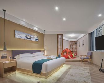Yichang Ouyin Luxury Hotel (Three Gorges University Wuyue Plaza Branch) - Yichang - Schlafzimmer