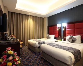 Ramee Guestline Hotel - Maskat - Yatak Odası