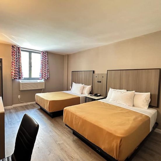 Bedroom view of Regal Inn & Suites New York Laguardia Hotel