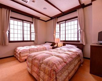Resort Inn Chirorian - Takayama - Schlafzimmer