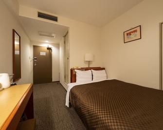 Kusatsu Daiichi Hotel - Kusatsu - Slaapkamer