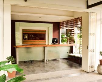 Qi Hotel and Club - Telipok - Front desk