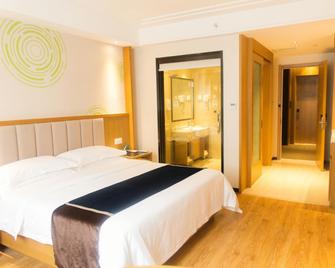 Greentree Inn Jiangsu Taizhou Taixing Middle Guoqing Road Business Hotel - Taizhou - Bedroom