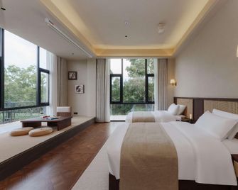 Floral Hotel· Fanchenli Hotel (Wanning Shimei Bay Shenzhou Station) - Wanning - Bedroom