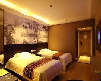 Greentree Inn Huzhou South Street Chaoyin Bridge Business Hotel - Huzhou - Спальня