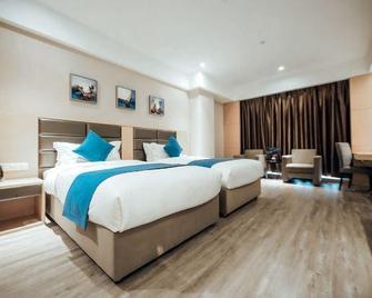 Boyaa Holiday Hotel (Hohhot Changlegong) - Hohhot - Slaapkamer