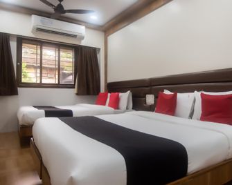Capital O 60020 Hotel Aditi International - Mumbai - Schlafzimmer