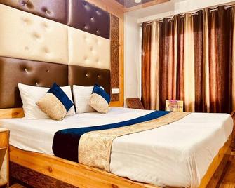 Hotel Solitaire Manali - Manali - Schlafzimmer