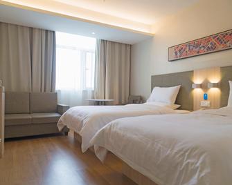 Hanting Hotel Handan Tianhong Square - Handan - Schlafzimmer
