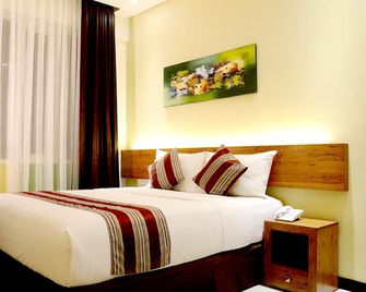 Biz Boulevard Hotel - Manado - Bedroom