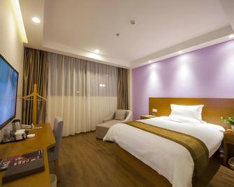 Greentree Inn Taizhou Jingjiang Zhongzhou Road Sunshine International Business Hotel - Taizhou - Bedroom