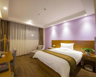 Greentree Inn Taizhou Jingjiang Zhongzhou Road Sunshine International Business Hotel - Taizhou - Schlafzimmer
