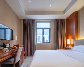 Hongcui Garden Hotel (Linyi Taisheng Plaza Branch) - Linyi - Bedroom