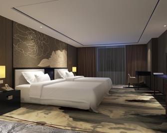 Warmyes Business Hotel - غوانغزهو - غرفة نوم