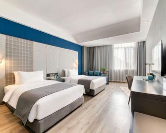 Lanou Hotel (Heze Mudan Park Baicheng University Town) - Heze - Спальня