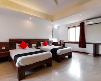 Super Capital O Sai Arya Residency - Mangalore - Bedroom