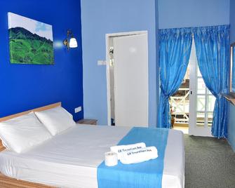 CH Travellers Inn - Brinchang - Habitación