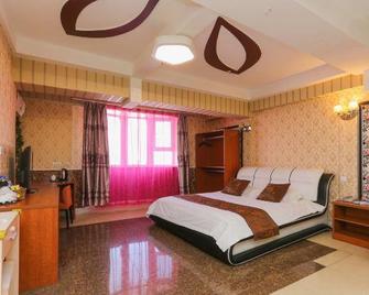 Jiexika Business Theme Hotel - Čchang-čchun - Ložnice