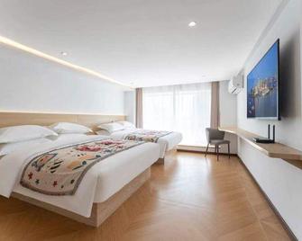 Weihai Jiaqi Hotel (Weihai high speed railway bus terminal store) - Weihai - Camera da letto