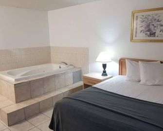 Niagara Falls Courtside Inn - ניאגרה פולס - חדר שינה