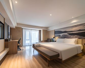 Vienna Hotel Harbin Haxi High-Speed Railway Station Wanda Plaza - Harbin - Bedroom