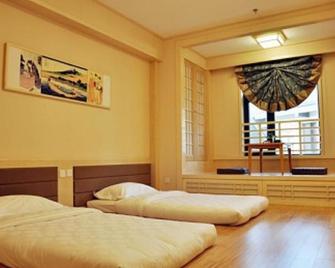 Shijiazhuang Guoyu Hotspring Holiday Hotel - Shijiazhuang - Habitación