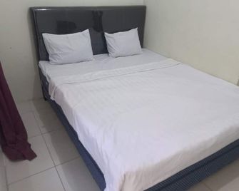 Hotel O Chimi Rumah Kost - Purwokerto - Bedroom