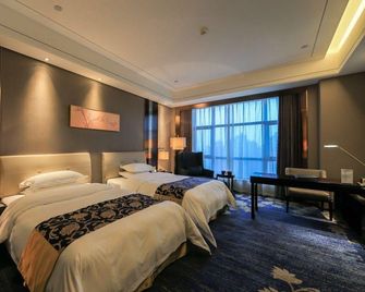 Grand Jin Ou International Hotel - Yangzhou - Schlafzimmer