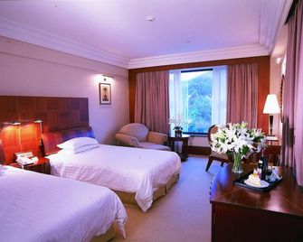 Nanshan Garden Hotel - דאליין - חדר שינה