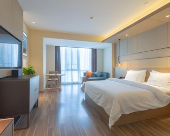 Jinjiang Metropolo Hotel Weihai Railway Station Branch - Weihai - Schlafzimmer
