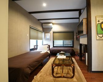 Traditional Apartment Takamatsu Guesthouse - Takamatsu - Soveværelse