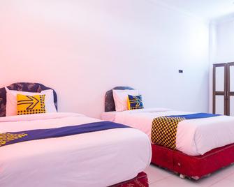 Spot On 2318 Citra Palm Residence - Kupang - Ložnice