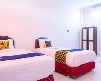 Spot On 2318 Citra Palm Residence - Kupang - Schlafzimmer